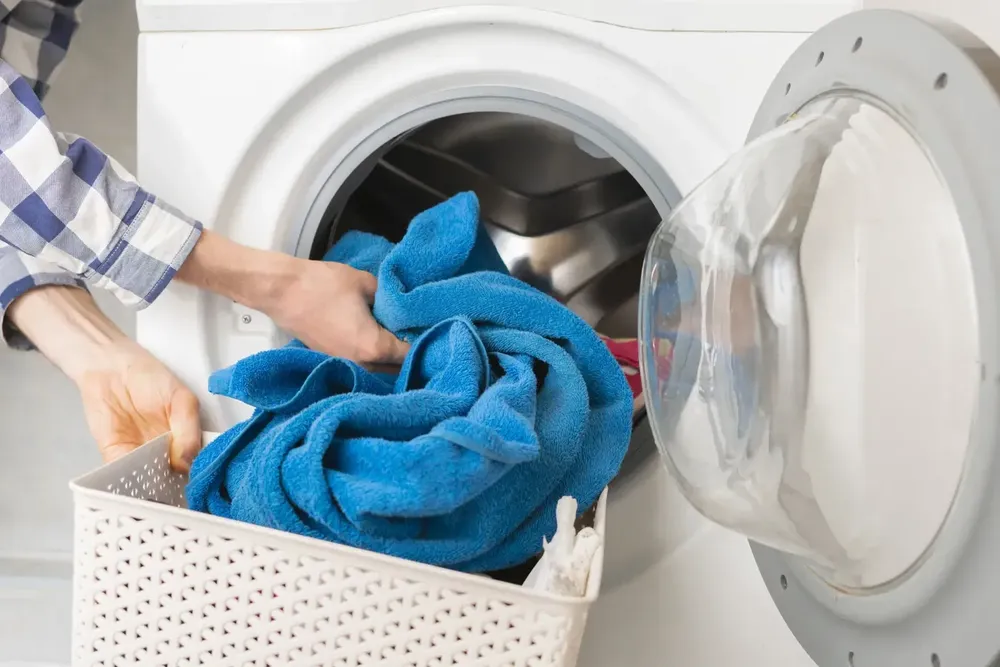 Taking a towel out of a washing machine